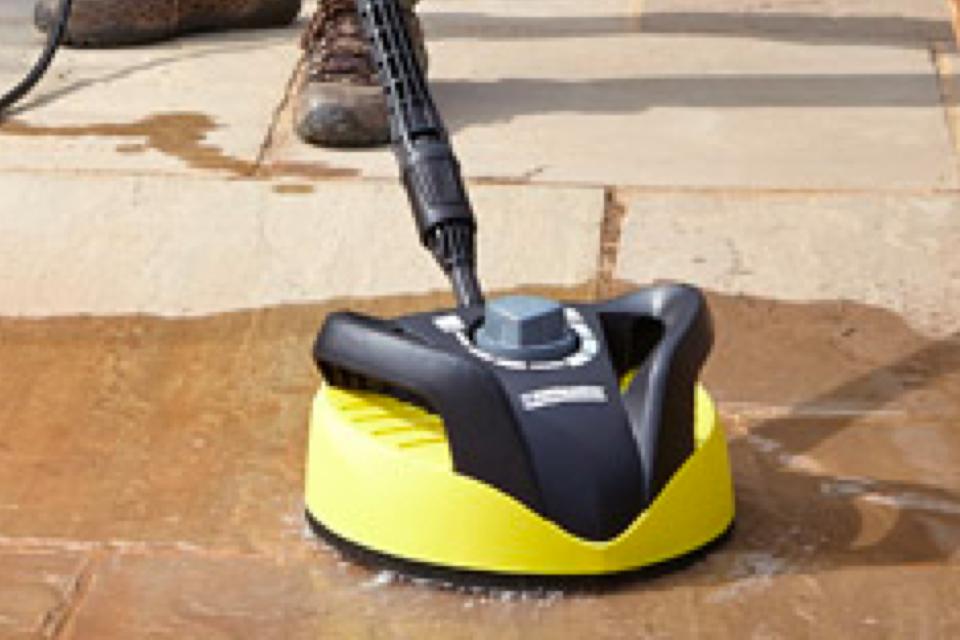 Using a patio pressure washer.