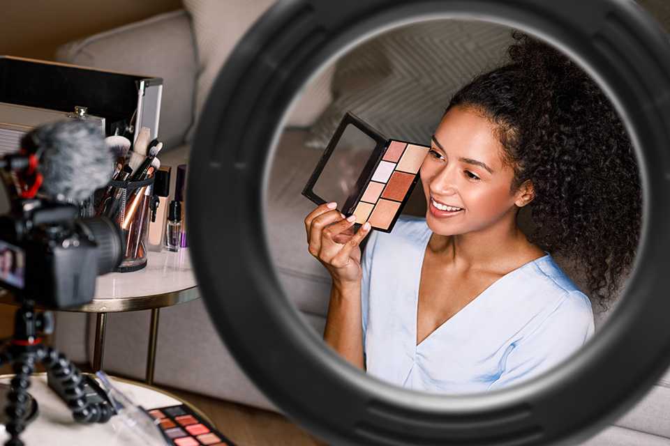 A teenage girl shooting a makeup video.