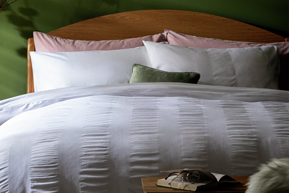 A Habitat mini waffle striped white bedding set.