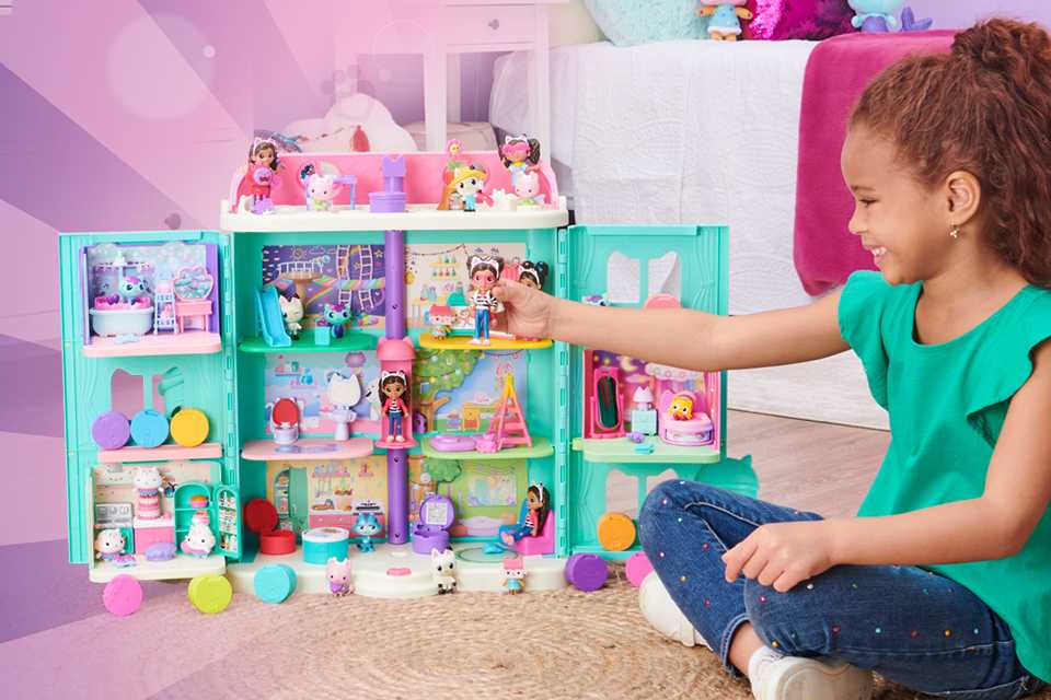 A girl playing with a toy set.