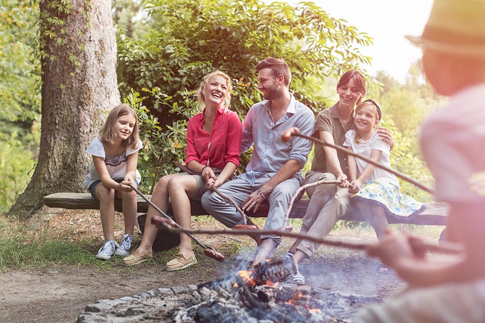 Family around a campfire.