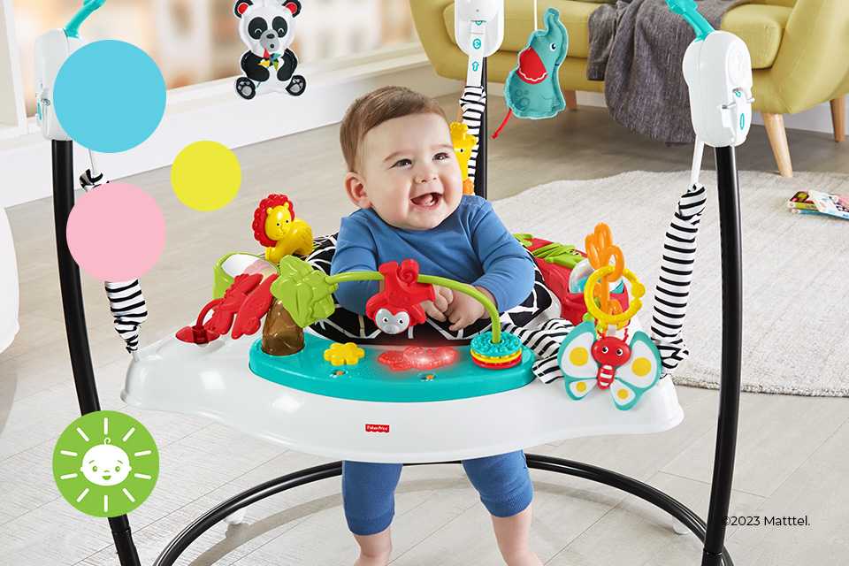 A baby playing with a Fisher-Price Animal Wonders jumperoo.