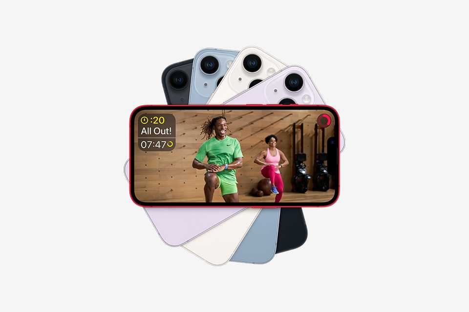 An iPhone displaying an exercise class that's shown within Apple Fitness+. Next to an Apple Watch displaying various workout metrics in conjunction with the Apple Fitness+ class.