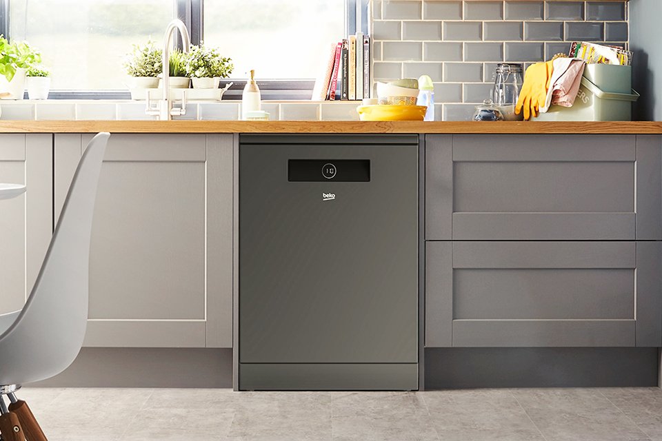 A grey Beko dishwasher in a modular kitchen setup.