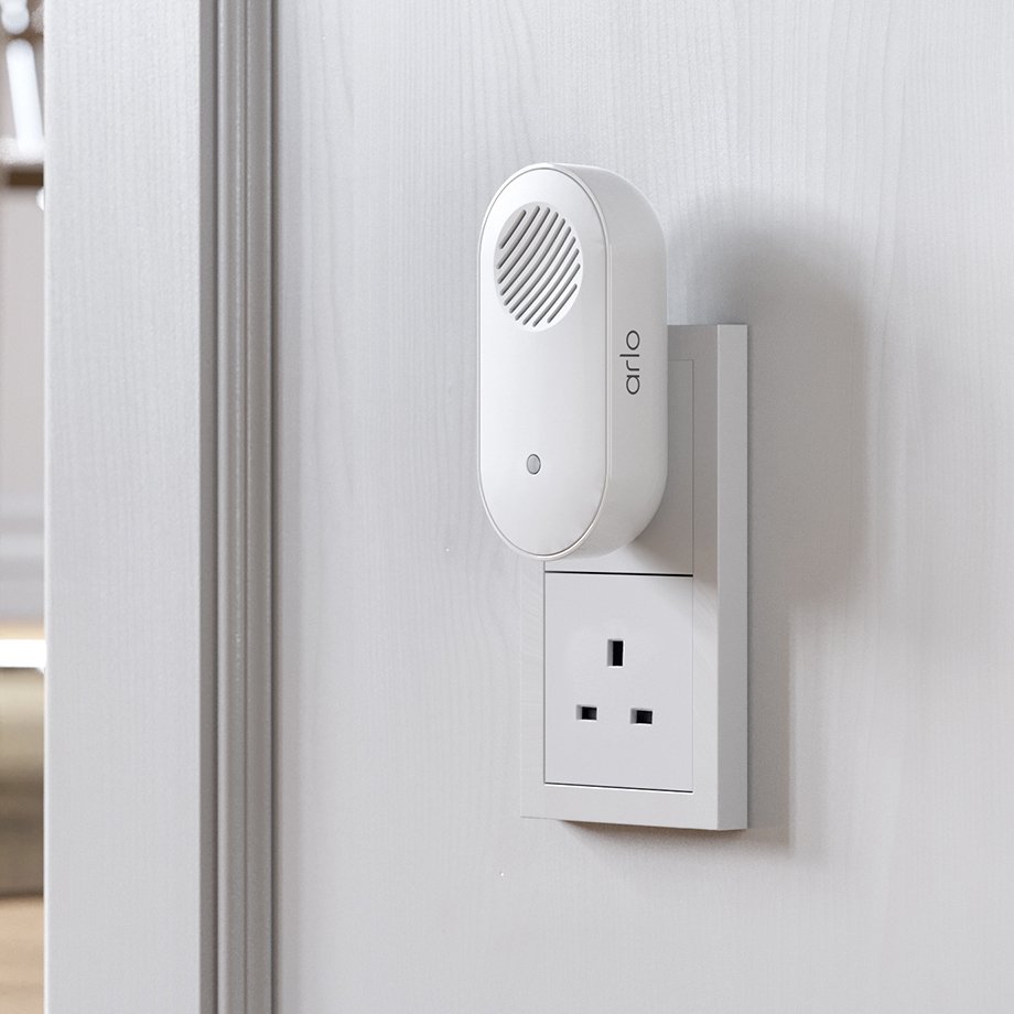 An Arlo Chime 2 smart doorbell mounted on a wall.