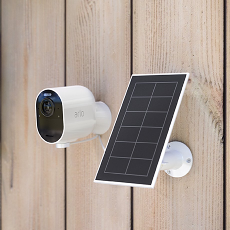 Arlo solar panel with magnet charge cable and an Arlo Essential HD outdoor security camera.