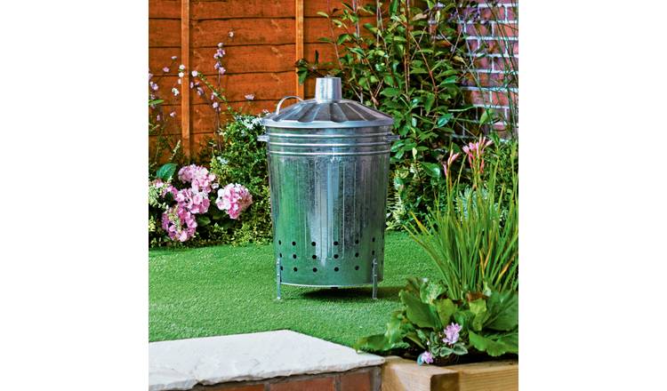 Garden incinerator bin burning waste from the garden. Stock Photo