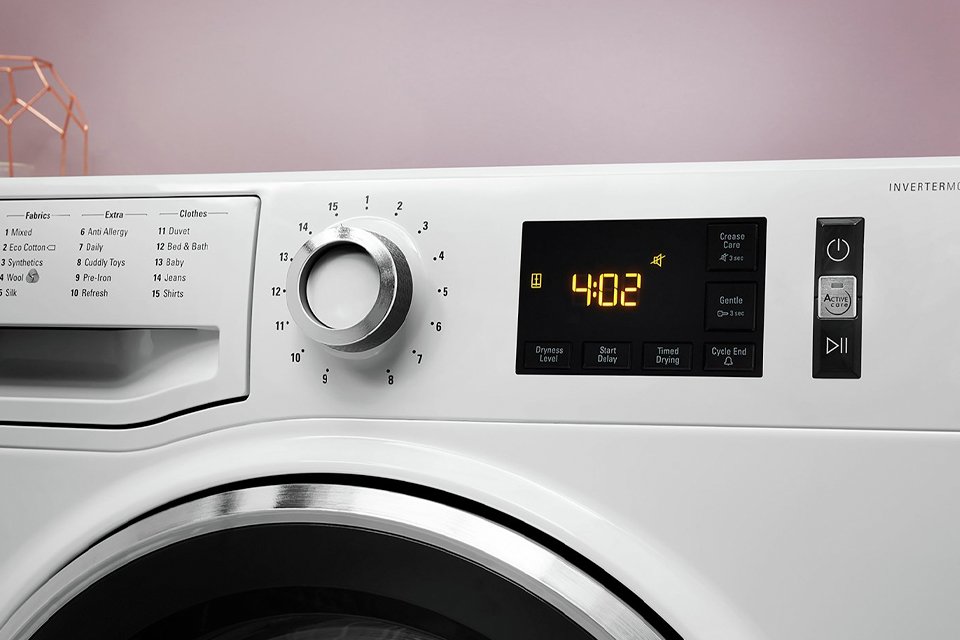 Hotpoint NTM1182XB 8KG Heat Pump Tumble Dryer in white.