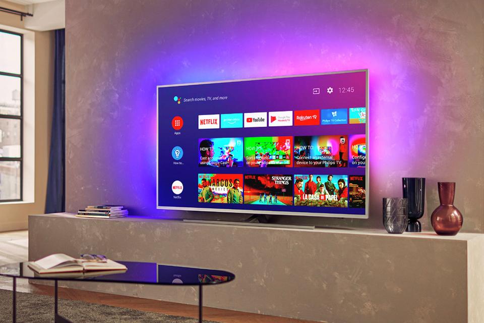 TV with bias lighting emanating a purple light.
