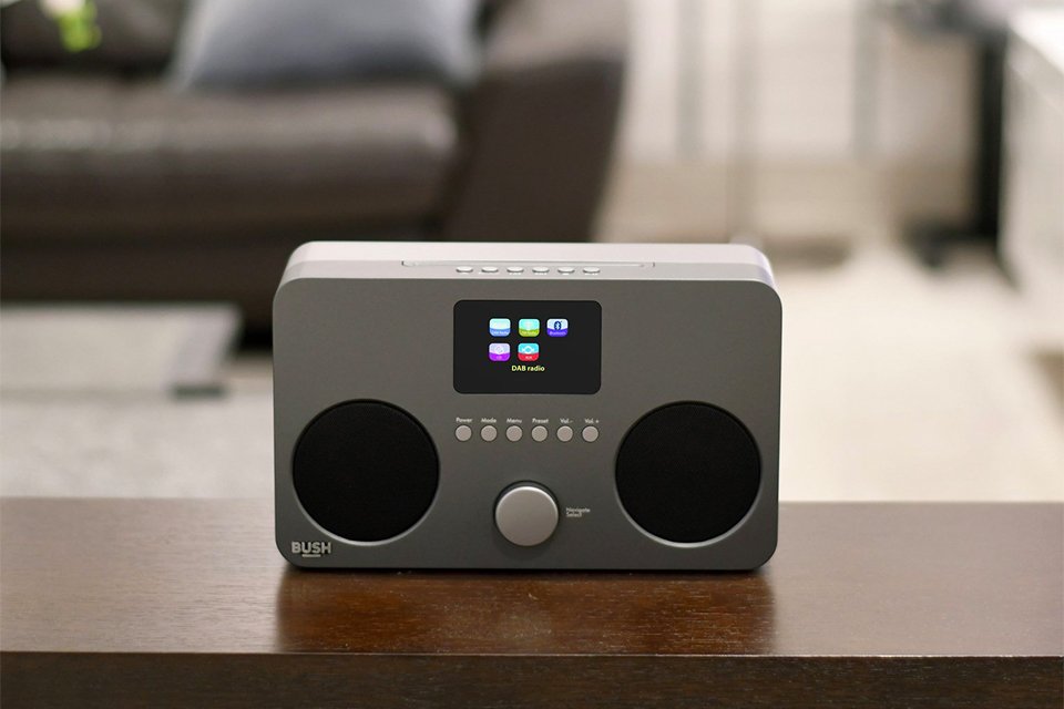 Bush all-in-one CD micro system on a wooden table.