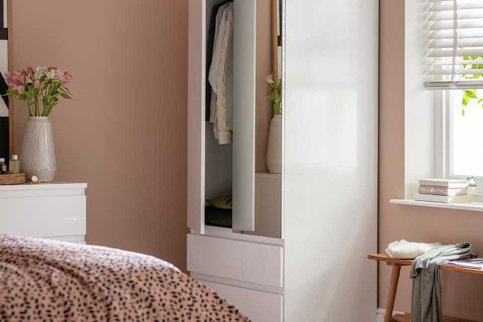 A Habitat Jenson 2-door 2-drawer mirror wardrobe in a bedroom.