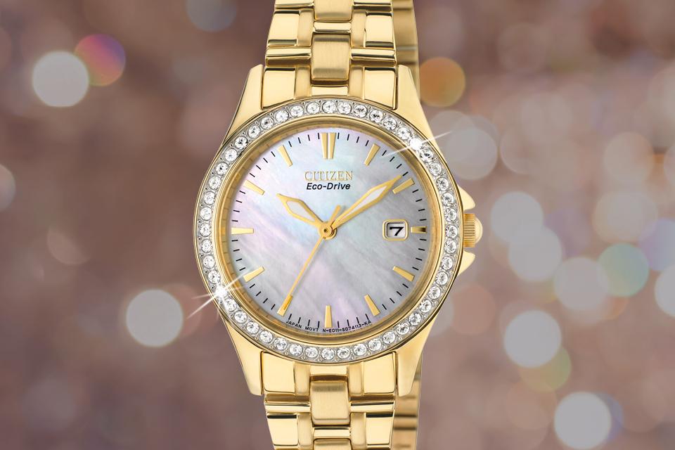 Image shows a gold Citizen ladies' watch superimposed on a sparkly background