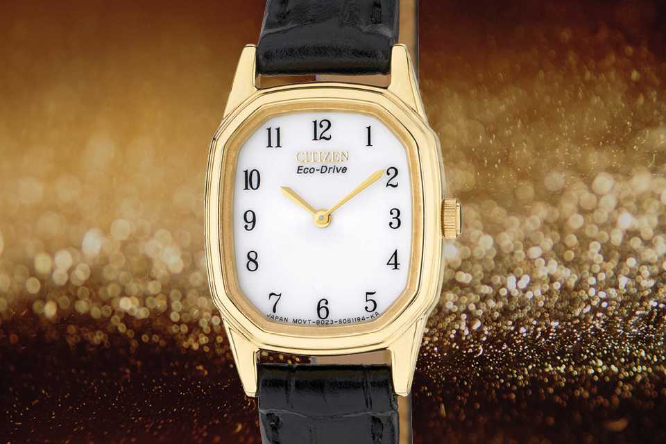 Image shows a Citizen ladies' strap watch superimposed on a sparkly background.