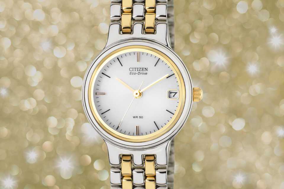 Image shows a two tone Citizen ladies' watch superimposed on a sparkly background.