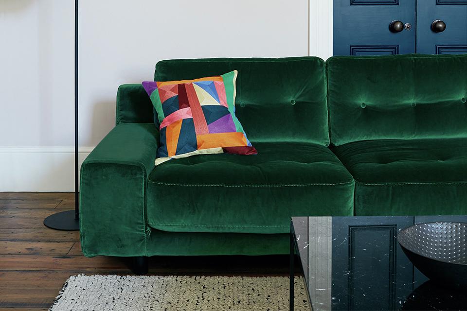 Green velvet sofa.