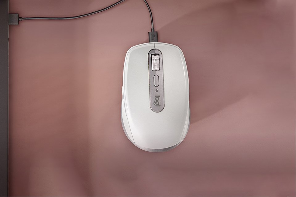 A Logitech MX Anywhere 3S Mac wireless mouse in pale grey.