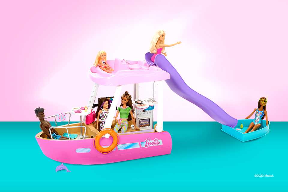  A Barbie Dream Boat Playset with a pool, a slide and other accessories.