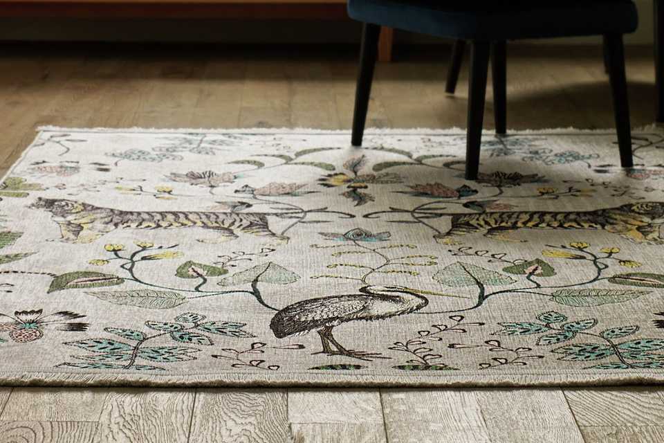 A Habitat jungle print flat rug.