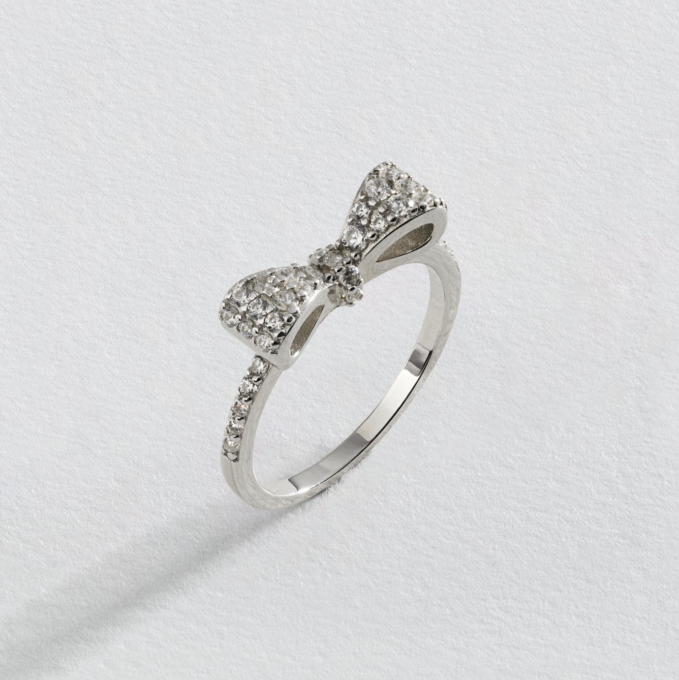 Revere Rhodium Plated Silver Cubic Zirconia Bow Ring - S