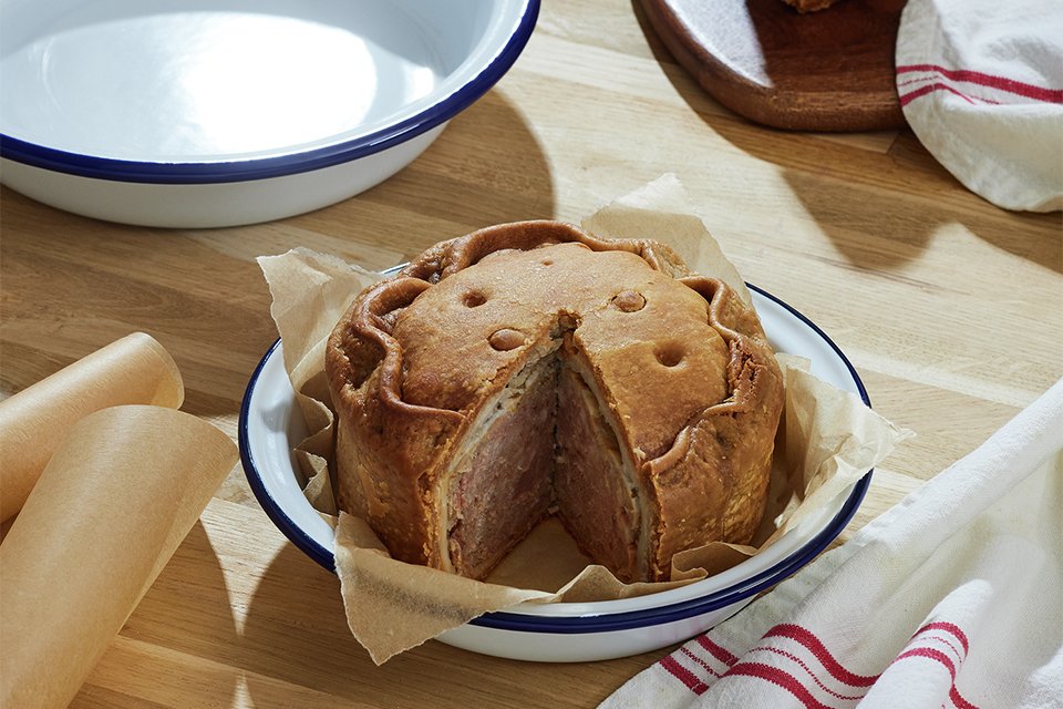A white Falcon Round Enamel Coated Steel Pie Dish set.
