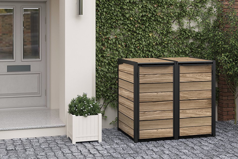 Keter Hideaway Bin Storage kept on a driveway.