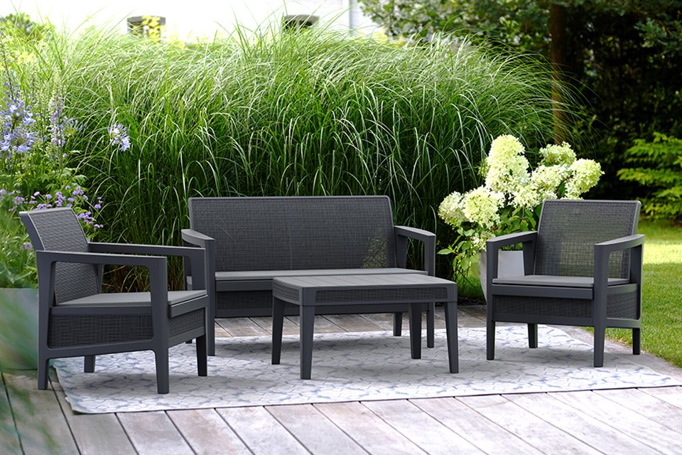 Keter Atlas Linea 4 Seater Lounge set displayed with plants behind.