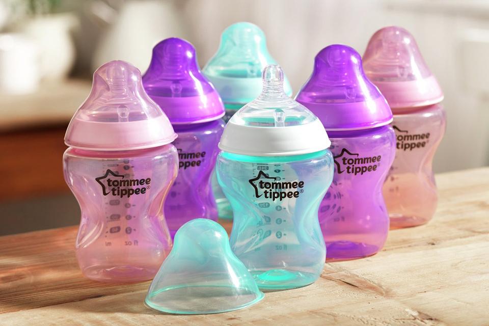 Six Tommee Tippee bottles in a range of colours.