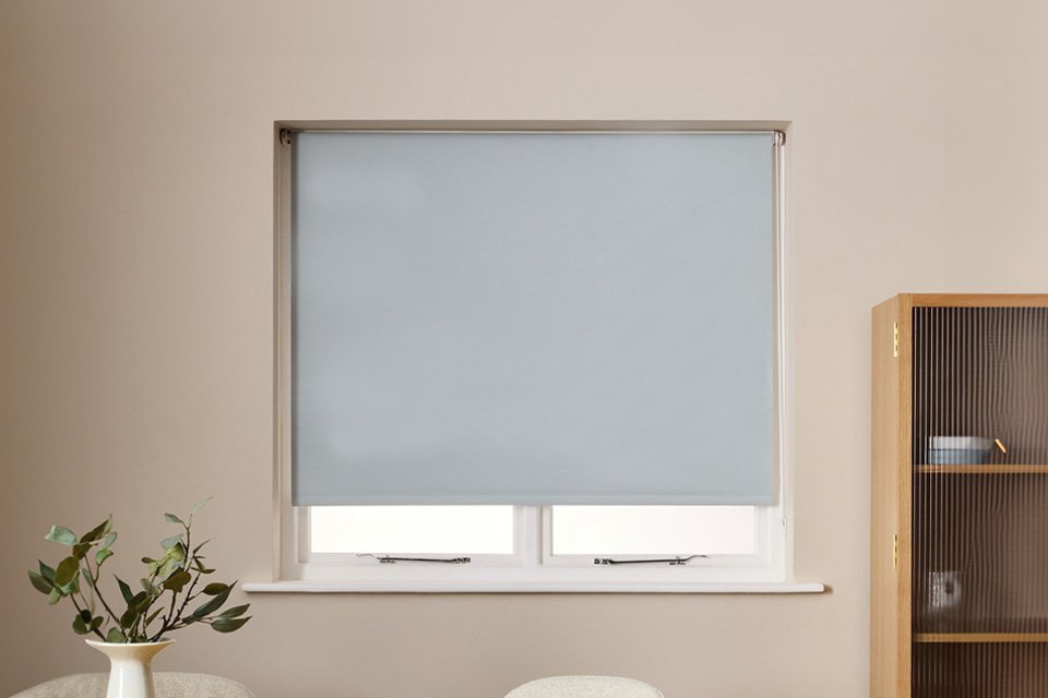 A Habitat 60cm Blackout blue roller blind.