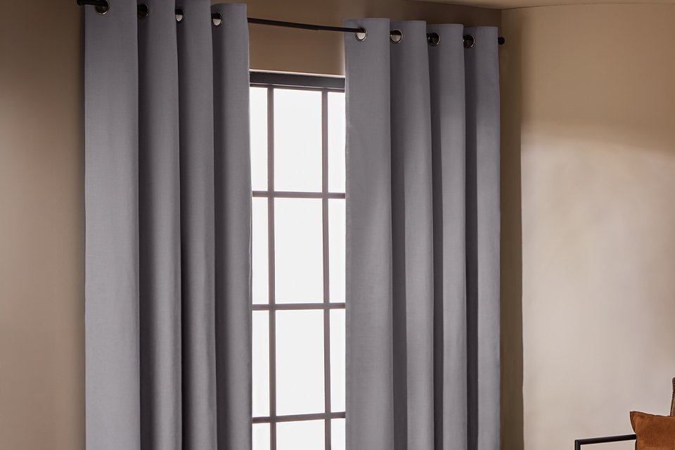 Habitat With Linen Blackout Eyelet Curtain in dove grey.