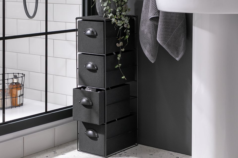 A Habitat Black Fabric Storage Tower near a bathroom screen.