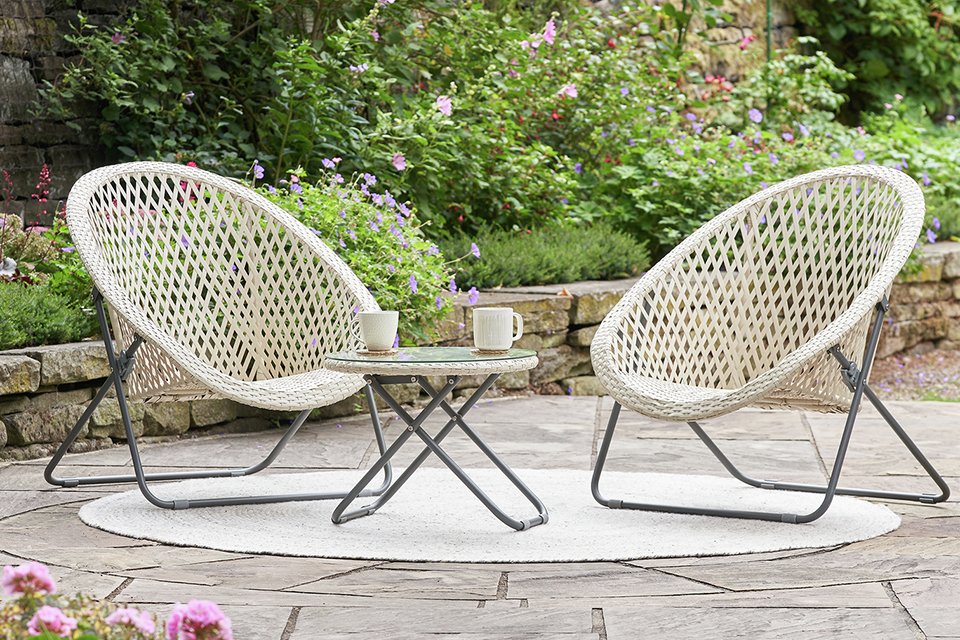 A grey Pacific Tobs set of 2 outdoor foldable loungers placed outdoors.