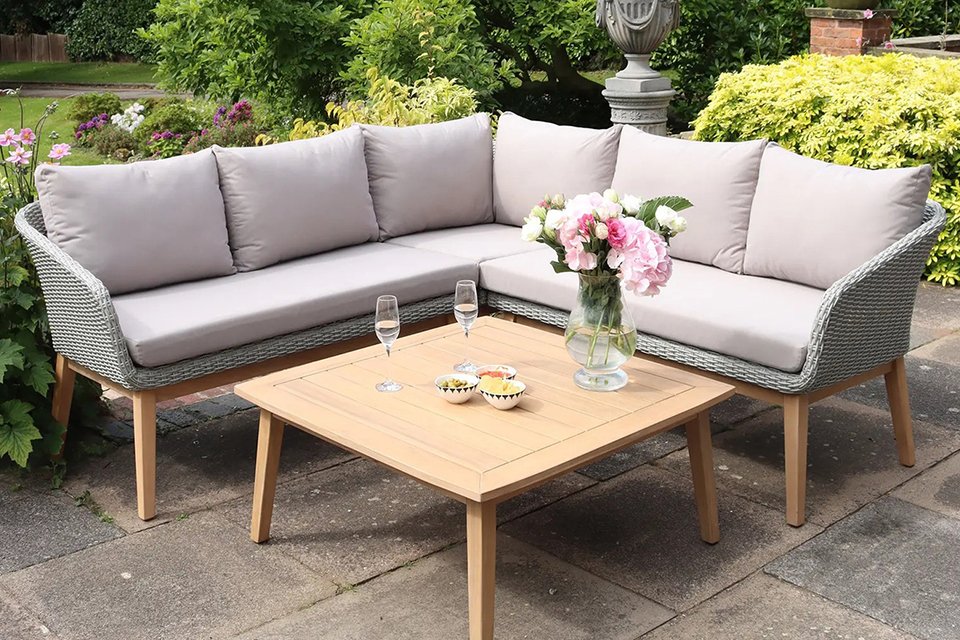 A grey Royalcraft square 5 seater wood corner lounging rattan set.
