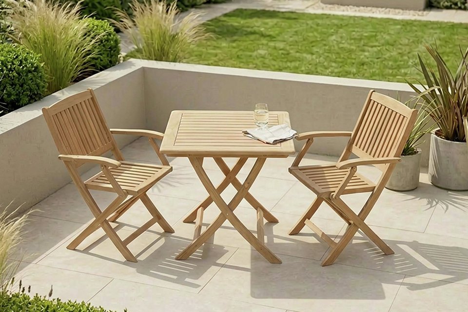 A Royalcraft 2 seater folding wood bistro set placed outdoors.