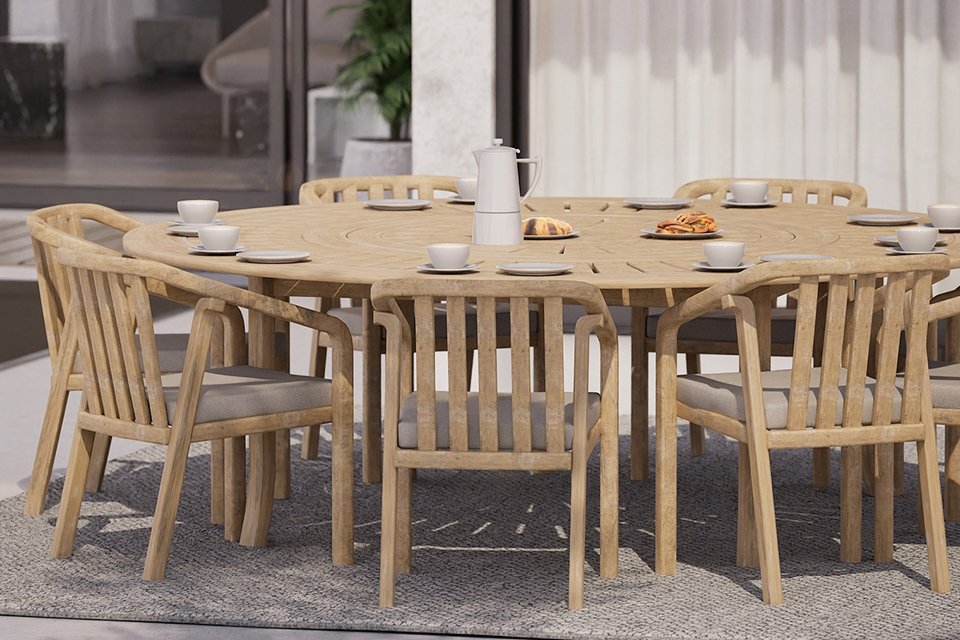 A Royalcraft 8 seater round wood dining set placed on a patio.