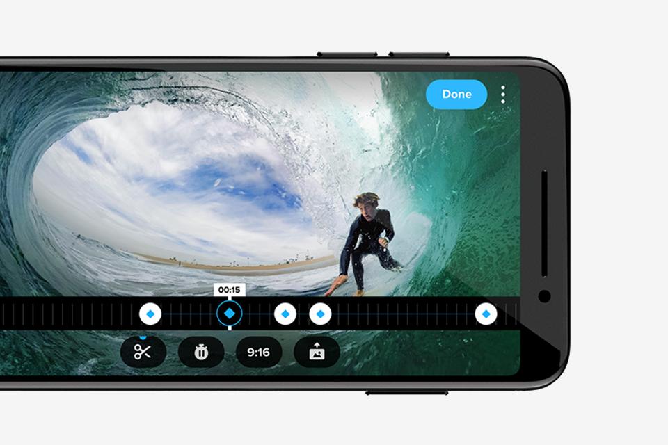 Image shows the Quik app in action on a phone. It's editing a video showing a surfer in the tube of a wave.