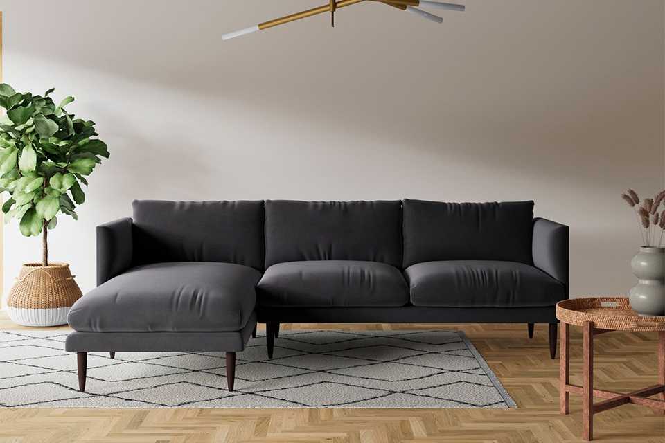 Swoon dark grey velvet sofa in living room.