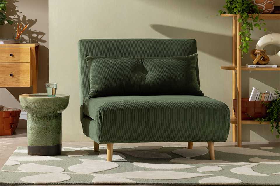 Habitat roma chair bed in green cord material.