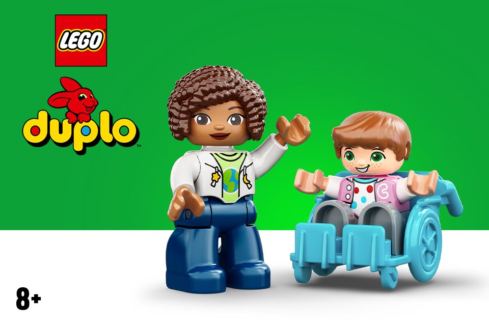 Two LEGO® DUPLO figures on a green background.