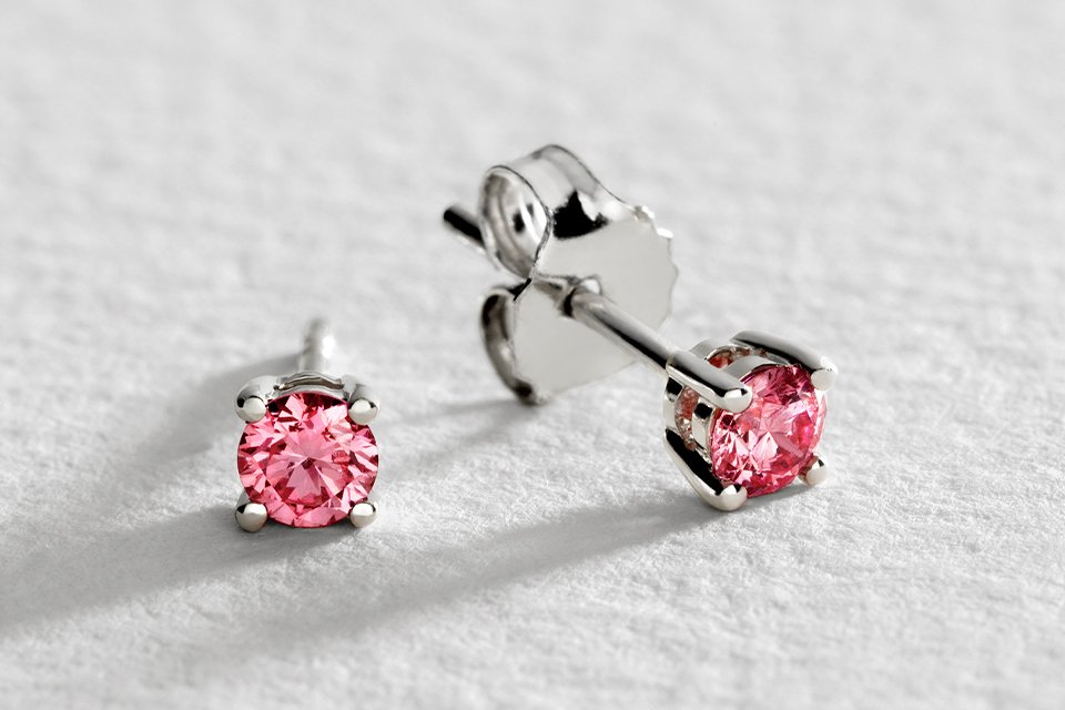 A Pure Brilliance set of white gold pink diamond earrings.