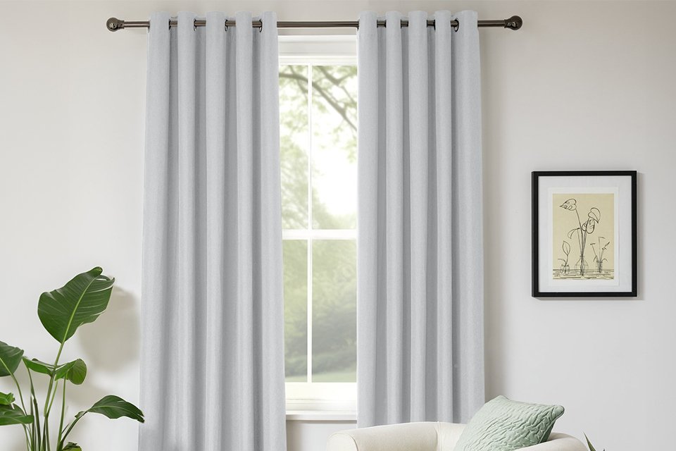 Habitat Blackout Eyelet Curtain in dove grey colour.