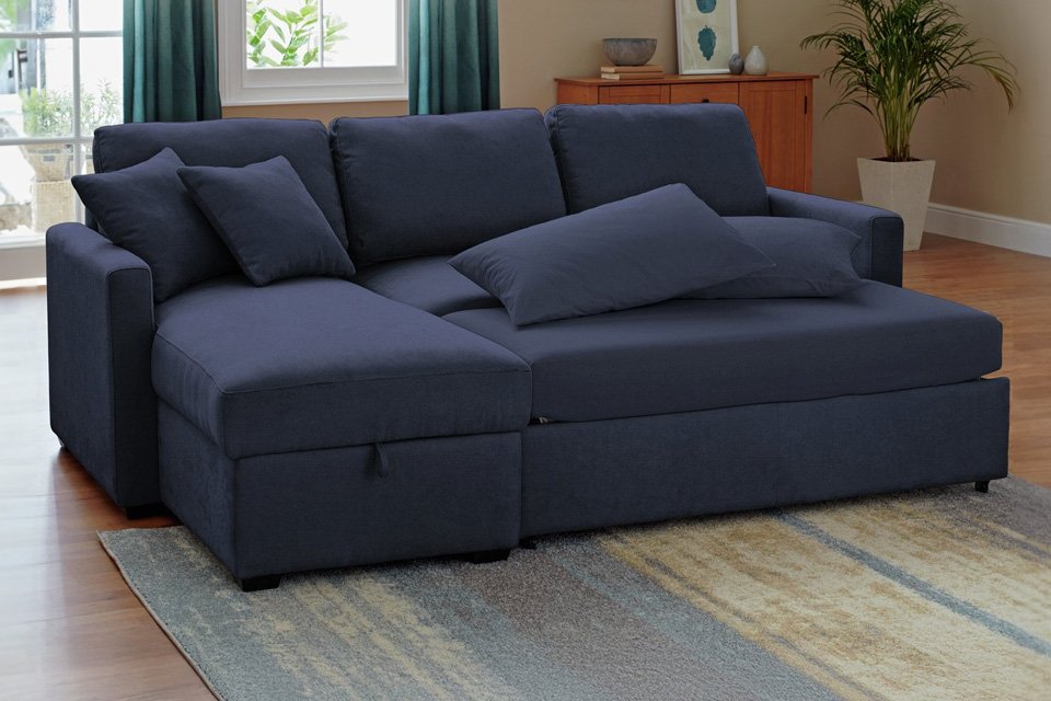 A navy Habitat Reagan corner chaise sofabed in a living room.