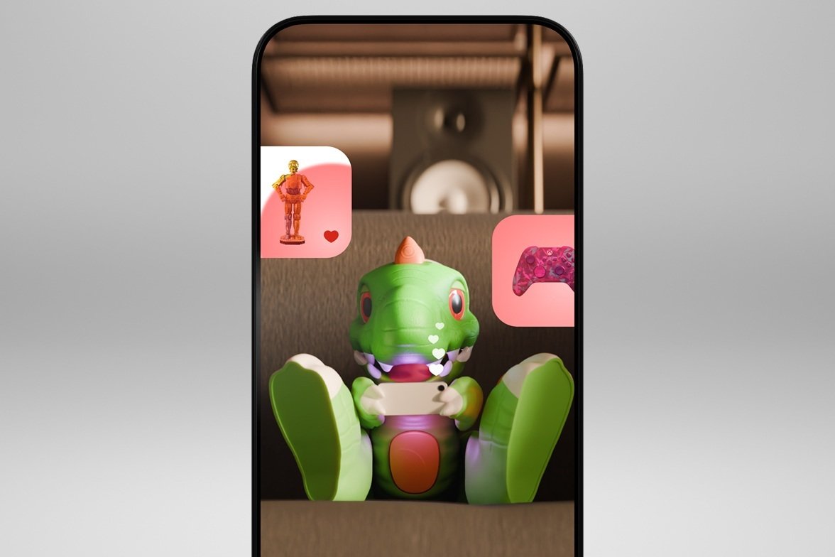A phone showing the Argos App with Trevor the dinosaur.