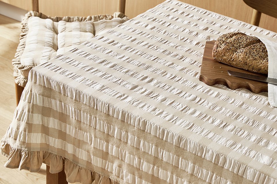 Argos Home Gingham Tablecloth in beige and white colour. 