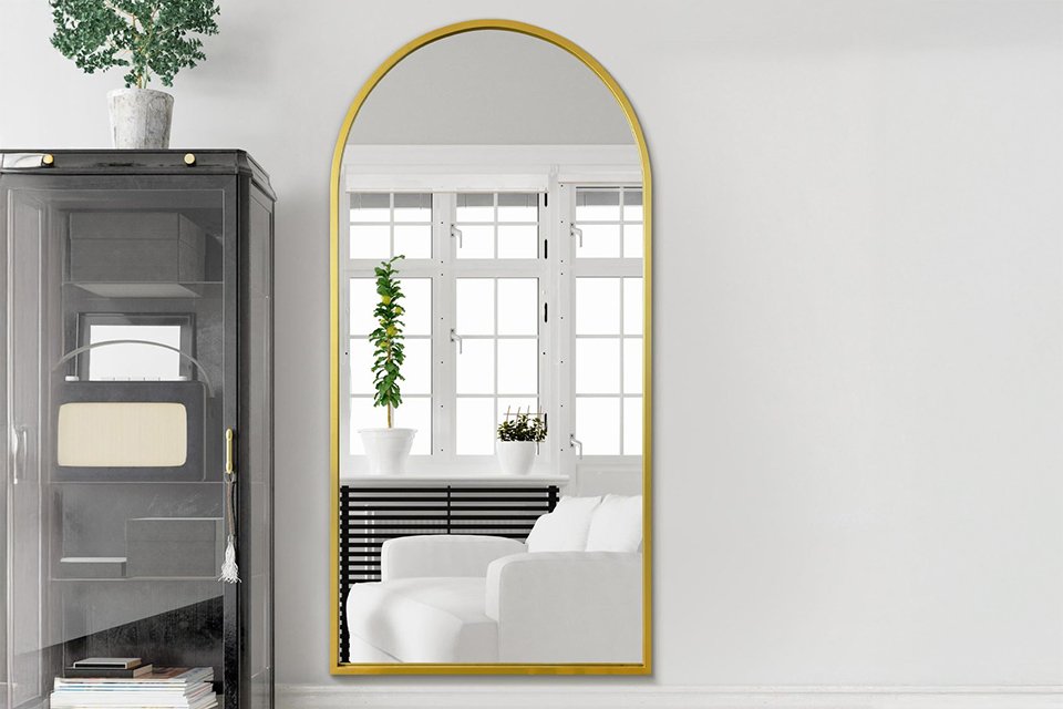 A MirrorOutlet Arcus Gold Metal Arch Wall Mirror.