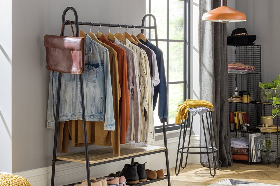Space saving wardrobe rail in bedroom.