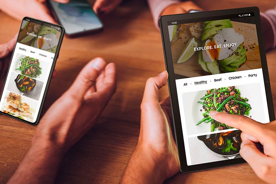 A group of people on a tablet and smartphone.