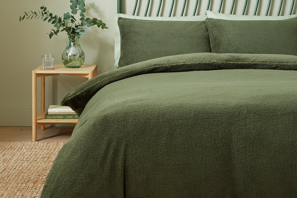 Home green fleece bedding set single on a green bed.