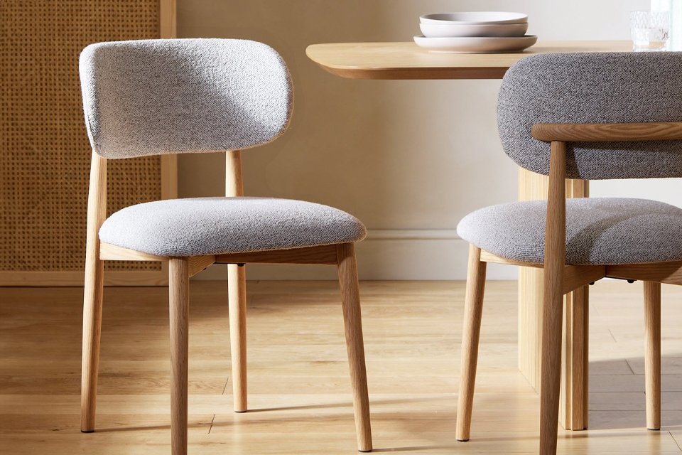 A pair of Habitat Arona natural oak chairs.