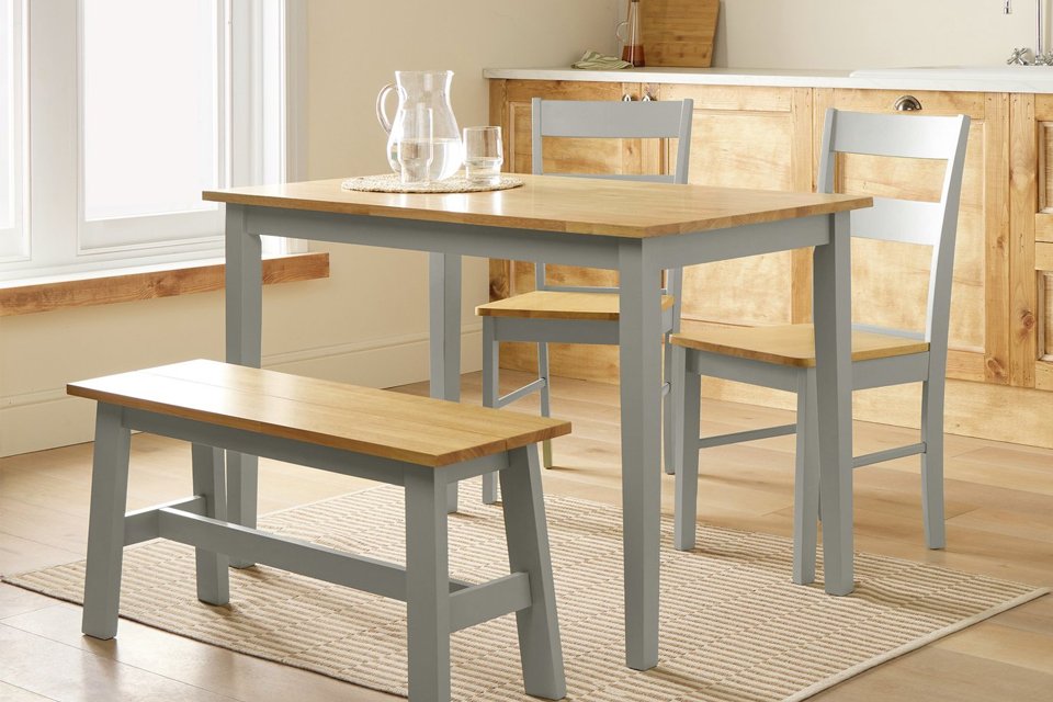 An Ah Chicago TT grey table set with 2 chairs and 1 bench.