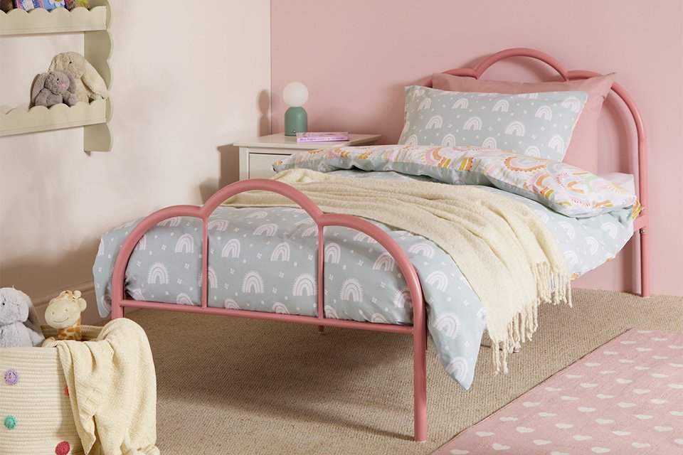 An Argos Home Kids Cora scalloped metal single bed frame in pink.